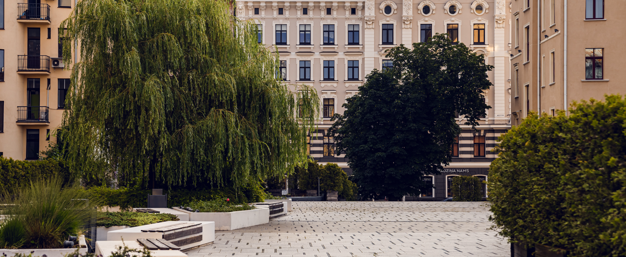 A cozy city view of Riga’s center with parks, streets, and historical buildings surrounding the CENTRUS quarter.