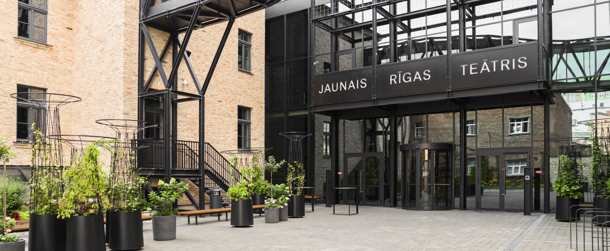 A cozy city view of Riga’s center with parks, streets, and historical buildings surrounding the CENTRUS quarter.